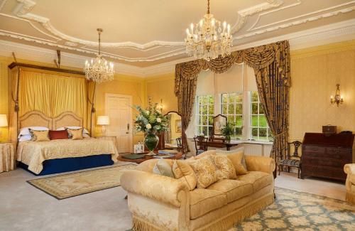 a living room with a couch and a bed at Glenapp Castle in Ballantrae