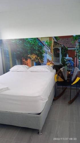 a bed sitting on top of a balcony at Hermoso Aparta Estudio pequeño in Cartagena de Indias