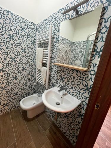 a bathroom with a sink and a mirror at B&B San Marco in San Lorenzello
