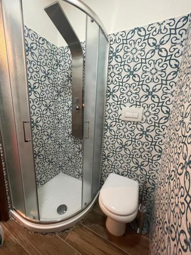 a bathroom with a toilet and a shower at B&B San Marco in San Lorenzello
