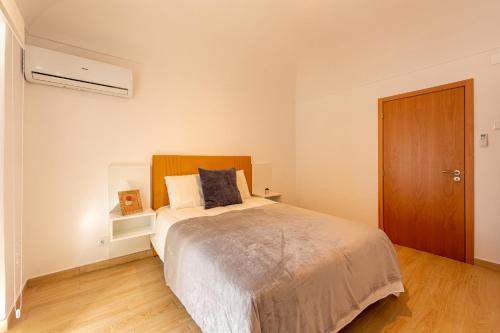 Katil atau katil-katil dalam bilik di Luxury Palm Suites