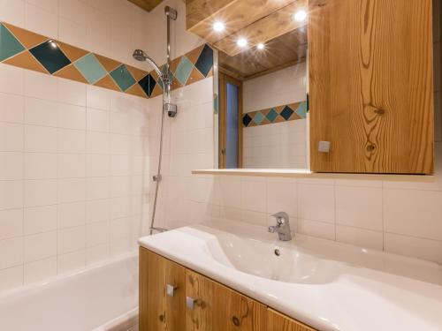 a bathroom with a sink and a bath tub at Appartement La Clusaz, 4 pièces, 8 personnes - FR-1-437-46 in La Clusaz