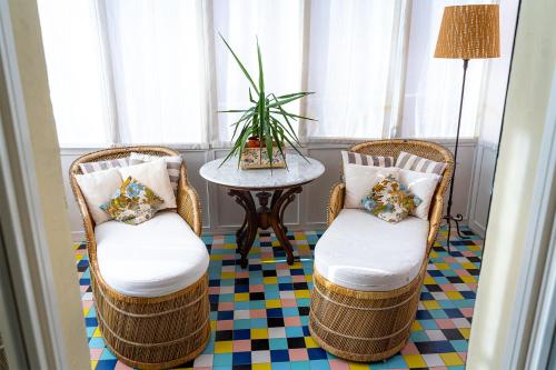 a room with two chairs and a table at Dimora Villa Ricci in Pedaso