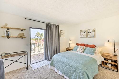 a bedroom with a bed and a large window at Modern Fountain Hills Townhome with Private Patio! in Fountain Hills