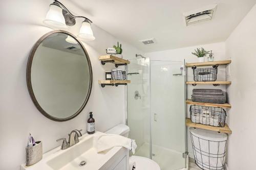 a bathroom with a sink and a mirror at Modern Fountain Hills Townhome with Private Patio! in Fountain Hills