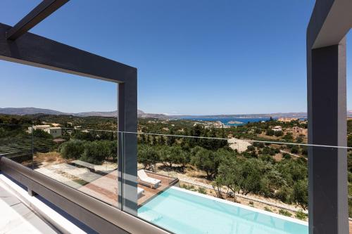 a view from the balcony of a house with a swimming pool at Eloa Luxury Villa in Chania Town