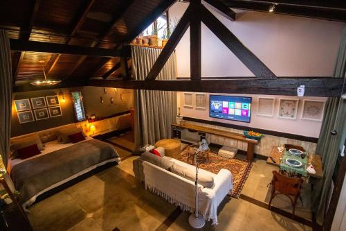 an overhead view of a living room with a tv at O Vilarejo - Lagoa da Conceição in Florianópolis