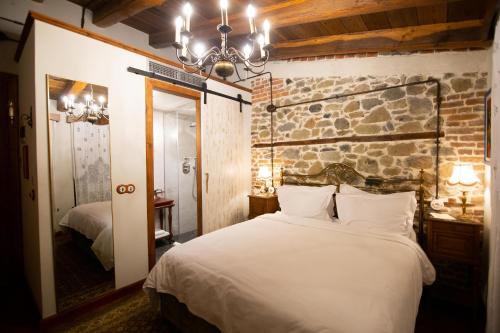 Vila Ebel Hotel Pool & Spaにあるベッド