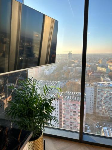a view of a city from a building at Hanza Tower HOME4U in Szczecin