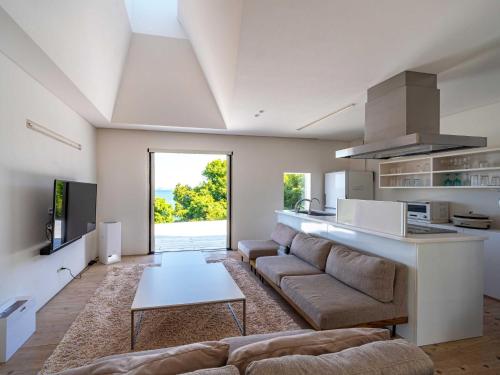 a living room with a couch and a table at NE-2930 - Vacation STAY 68092v in Awaji