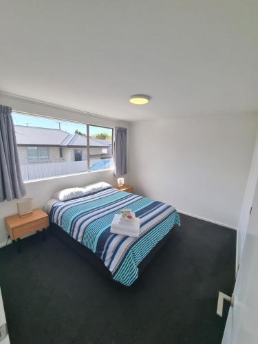 Postel nebo postele na pokoji v ubytování Edward Street Apartments