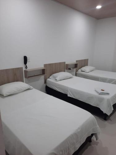 Postel nebo postele na pokoji v ubytování HOTEL MAR DEL CARIBE