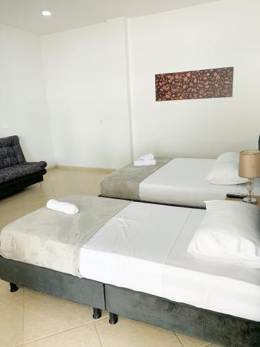 Postel nebo postele na pokoji v ubytování Hotel Santorini