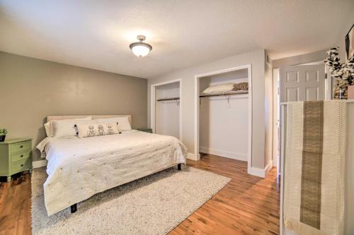a bedroom with a bed and a door with a window at Pocatello Retreat about 3 Mi to Downtown! in Pocatello