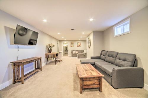 a living room with a couch and a tv at Pocatello Retreat about 3 Mi to Downtown! in Pocatello