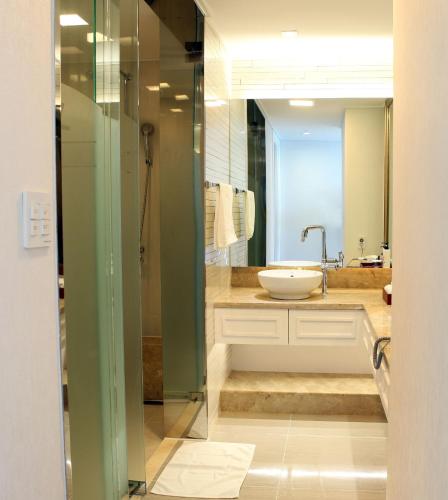 a bathroom with a sink and a mirror at Fontana Beach Hotel in Mokpo