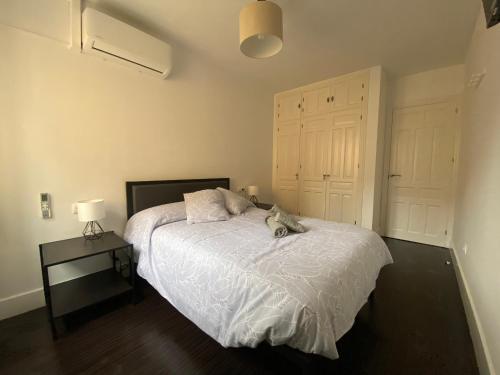 a bedroom with a dog laying on a bed at VUT Nohales Home in Nohales
