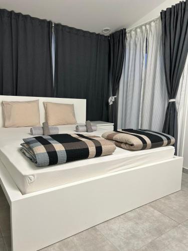 Ένα ή περισσότερα κρεβάτια σε δωμάτιο στο SKG Central Deluxe Studios