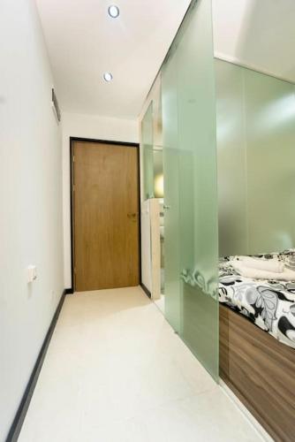 a bedroom with a sliding glass door and a bed at Secluded Mountain Cozy Studio with Fireplace in Bansko
