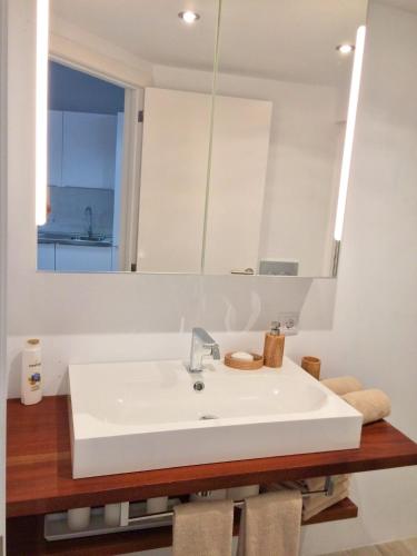 a bathroom with a white sink and a mirror at Hotel-Apartment Modern Studio in Palma de Mallorca