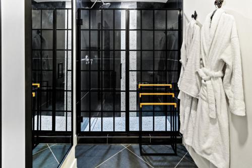 a black iron gate with clothes on hangers at Bespoke Inn Flagstaff in Flagstaff