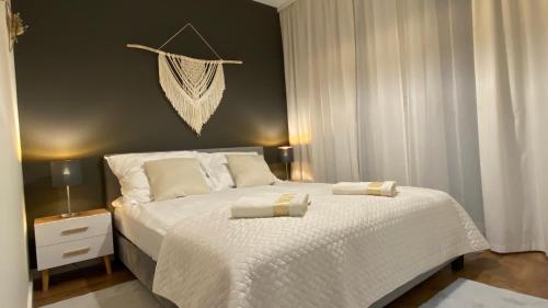 Ένα ή περισσότερα κρεβάτια σε δωμάτιο στο Apartament 3B