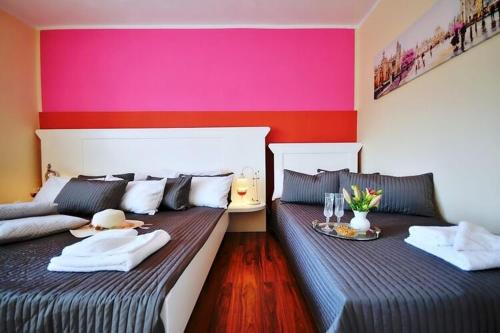 two beds sitting next to each other in a room at Comfortable apartment very close to sea, Ustronie in Ustronie Morskie