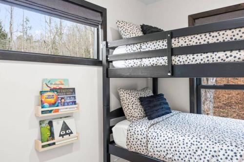 a bedroom with a bunk bed and a window at Pine Hill Chateau - Ski Belleayre, Hunter Mountain in Pine Hill