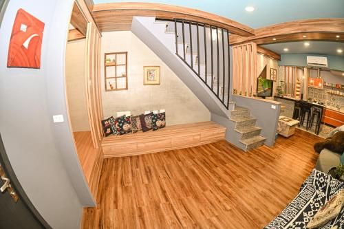 a spiral staircase in a home with wood floors at Yonghua 196 in Tainan