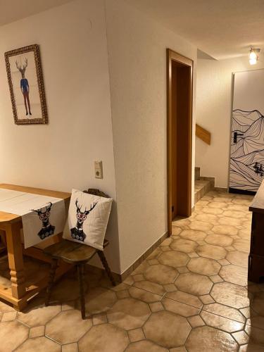 a living room with a table and a chair at Ferienwohnung Thöny Vandans in Vandans