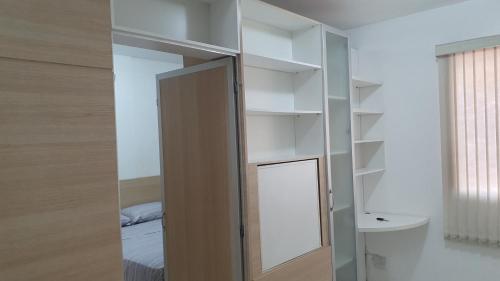 a room with a mirror and a bed and a bed at Ed. Boulevar Antares II in Brasília