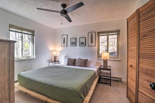 a bedroom with a bed and a ceiling fan at Rustic Getaway with Fireplace - Walk to Slopes! in Lyndhurst