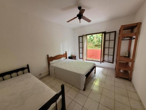 Postel nebo postele na pokoji v ubytování Cantinho da Fortaleza - Recém Renovada