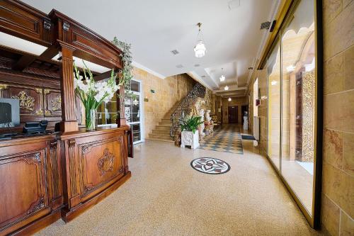 a hallway of a building with a large wooden cabinet at Zielony Kompleks Dwór Ostoya in Jasionka