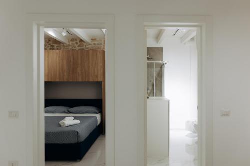 Säng eller sängar i ett rum på Amiura B&B