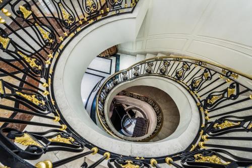 a spiral staircase in a building at Bentley London in London