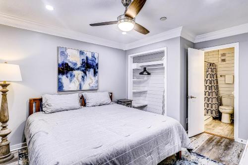 a bedroom with a bed and a ceiling fan at Carolina Beach Club, Unit 126 in Hilton Head Island