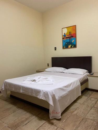 Postel nebo postele na pokoji v ubytování HOTEL e POUSADA DOM MANUEL - ÓTIMA LOCALIZAÇÃO