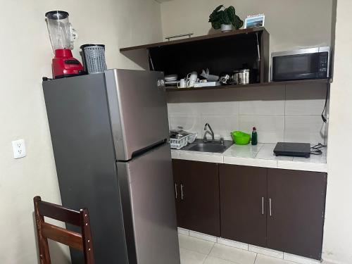 ALCOBY APARTMENTにあるキッチンまたは簡易キッチン