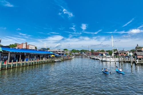 two boats in the water next to a marina at Ensign's Ridge in Annapolis