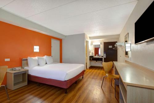a hotel room with a bed and a kitchen at Motel 6-Lakeville, MN - South - Lakeville in Lakeville