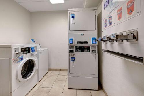 a laundry room with a washer and dryer at Motel 6-Lakeville, MN - South - Lakeville in Lakeville