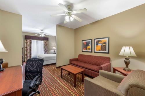 a living room with a couch and a bed at Best Western Plus Gadsden Hotel & Suites in Gadsden