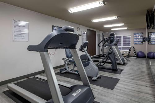 a gym with treadmills and elliptical machines at Best Western Plus Dartmouth Hotel & Suites in Halifax
