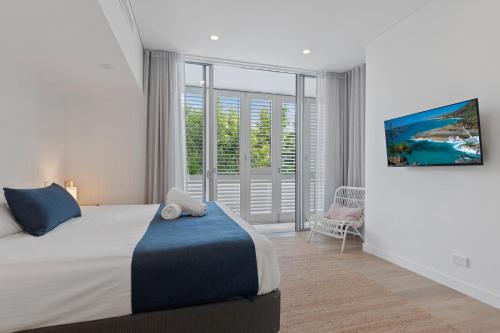 Ein Bett oder Betten in einem Zimmer der Unterkunft The Rise Noosa