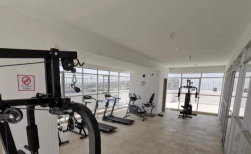 a gym with treadmills and ellipticals in a room at Exclusive House Cartagena in Cartagena de Indias