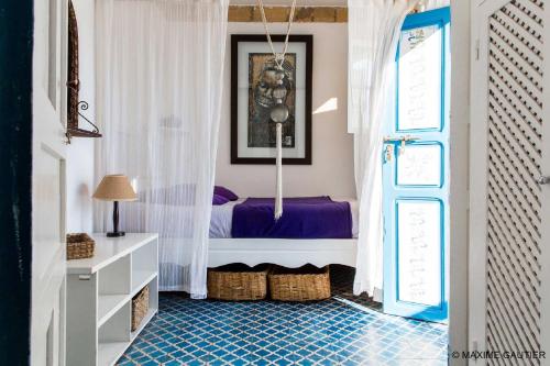 Ліжко або ліжка в номері Hôtel Emeraude Essaouira