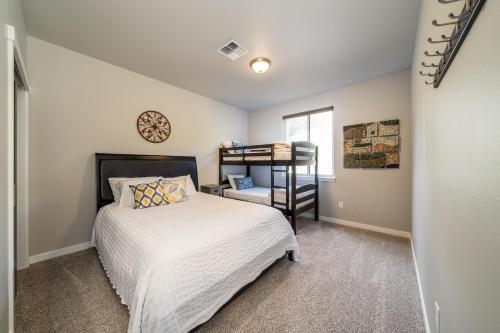 a small bedroom with a bed and a window at Marina's Edge Condo walk to restaurants and wineries condo in Manson