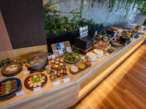a buffet with a lot of food on a table at Hotel Tsu Center Palace in Tsu