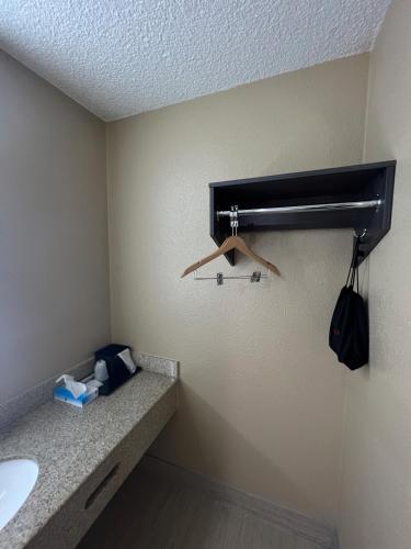 a bathroom with a sink and a towel rack on the wall at Super 8 by Wyndham Paducah I-24 Exit 4 in Paducah